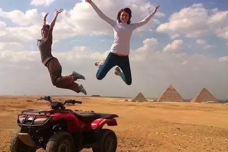 Desert safari by quad bike around pyramids enjoying sunset or sunrise